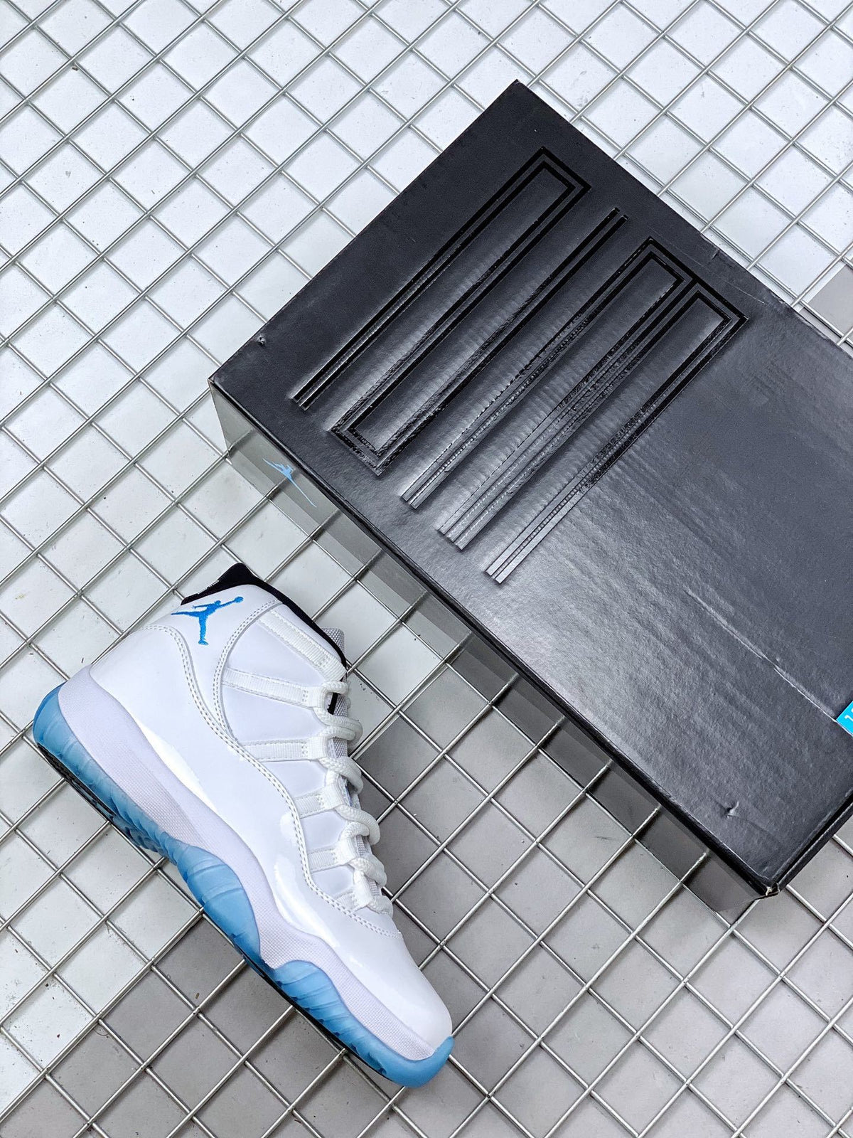 Jordan 11 Legend Blue Sneakers in White Blue 378037-117 - product image from the listing.
