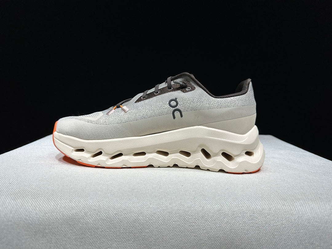 On Cloudtilt Trainers in Gray and Apricot - product image from the listing.