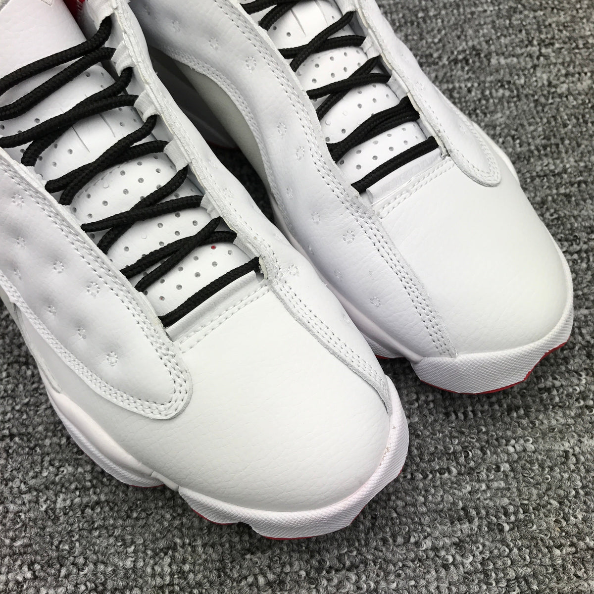 Air Jordan 13 High-Top Sneakers in White and Red - product image from the listing.
