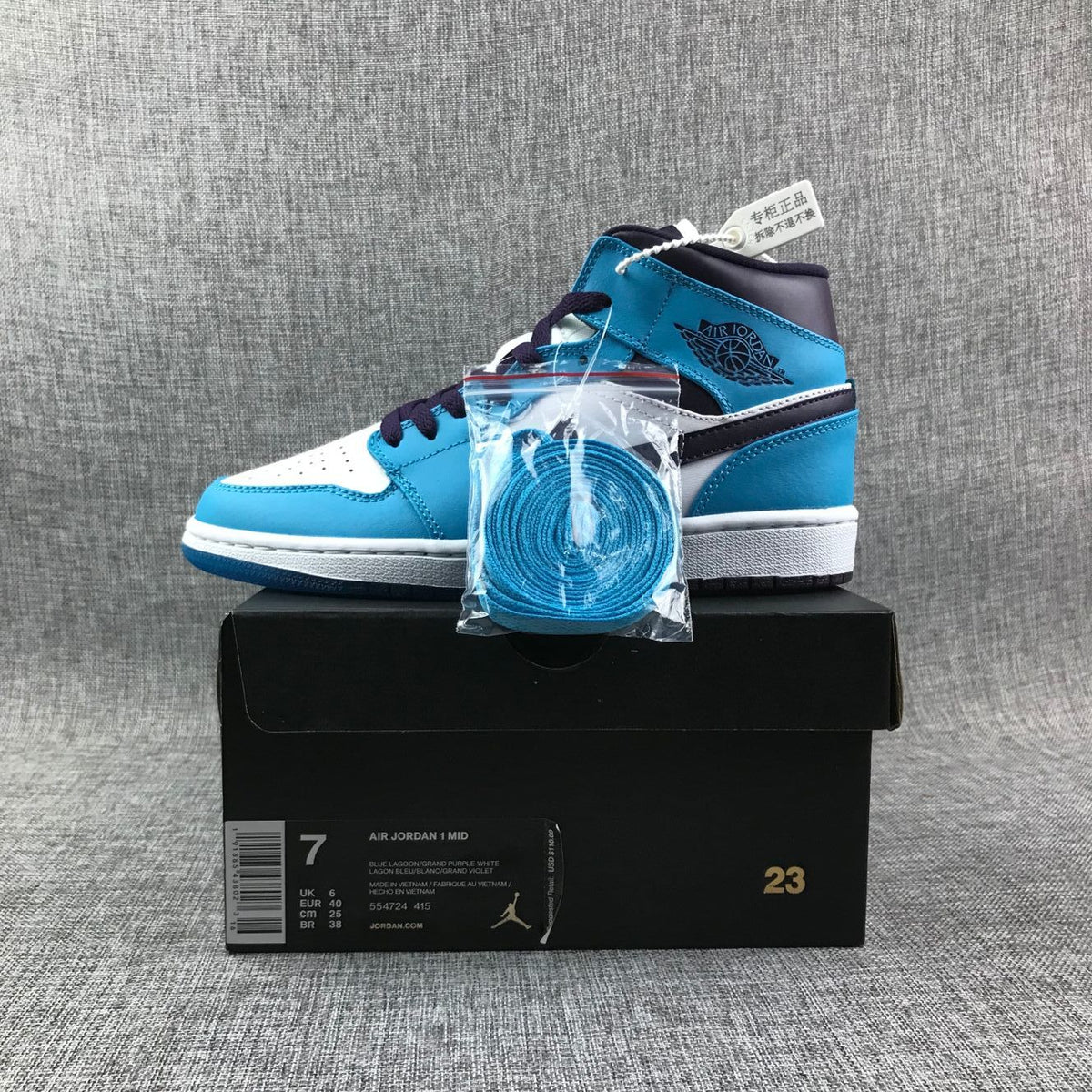 Air Jordan 1 Mid Sneakers in Blue, in White and Black - product image from the listing.