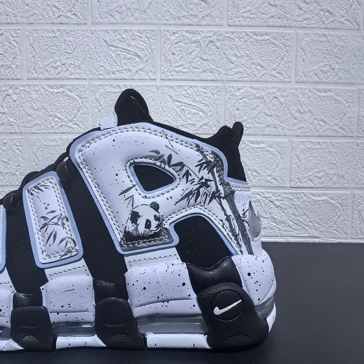 Nike Air More Uptempo Panda Sneakers in Black and White - product image from the listing.