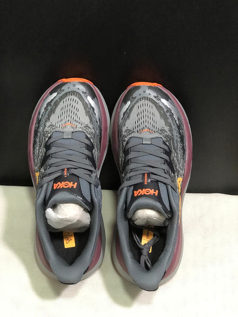 HOKA Stinson 7 Trail Running Shoes in Gray Orange - product image from the listing.
