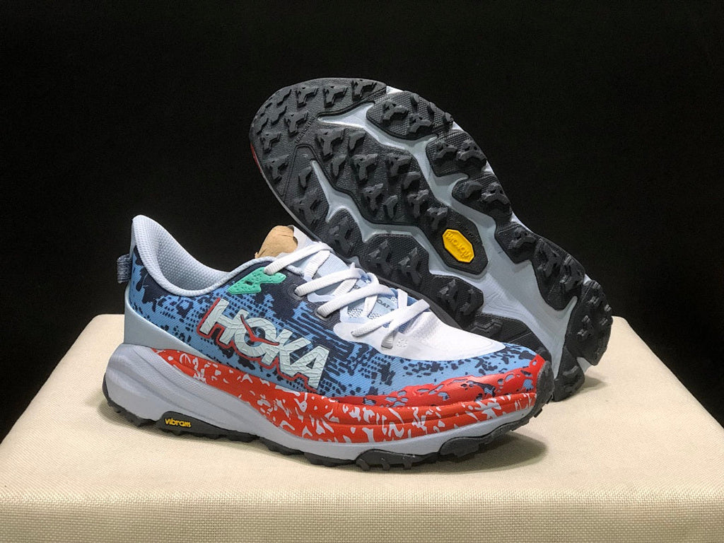 HOKA Speedgoat 6 Trail Running Shoes, in Blue and Orange - product image from the listing.