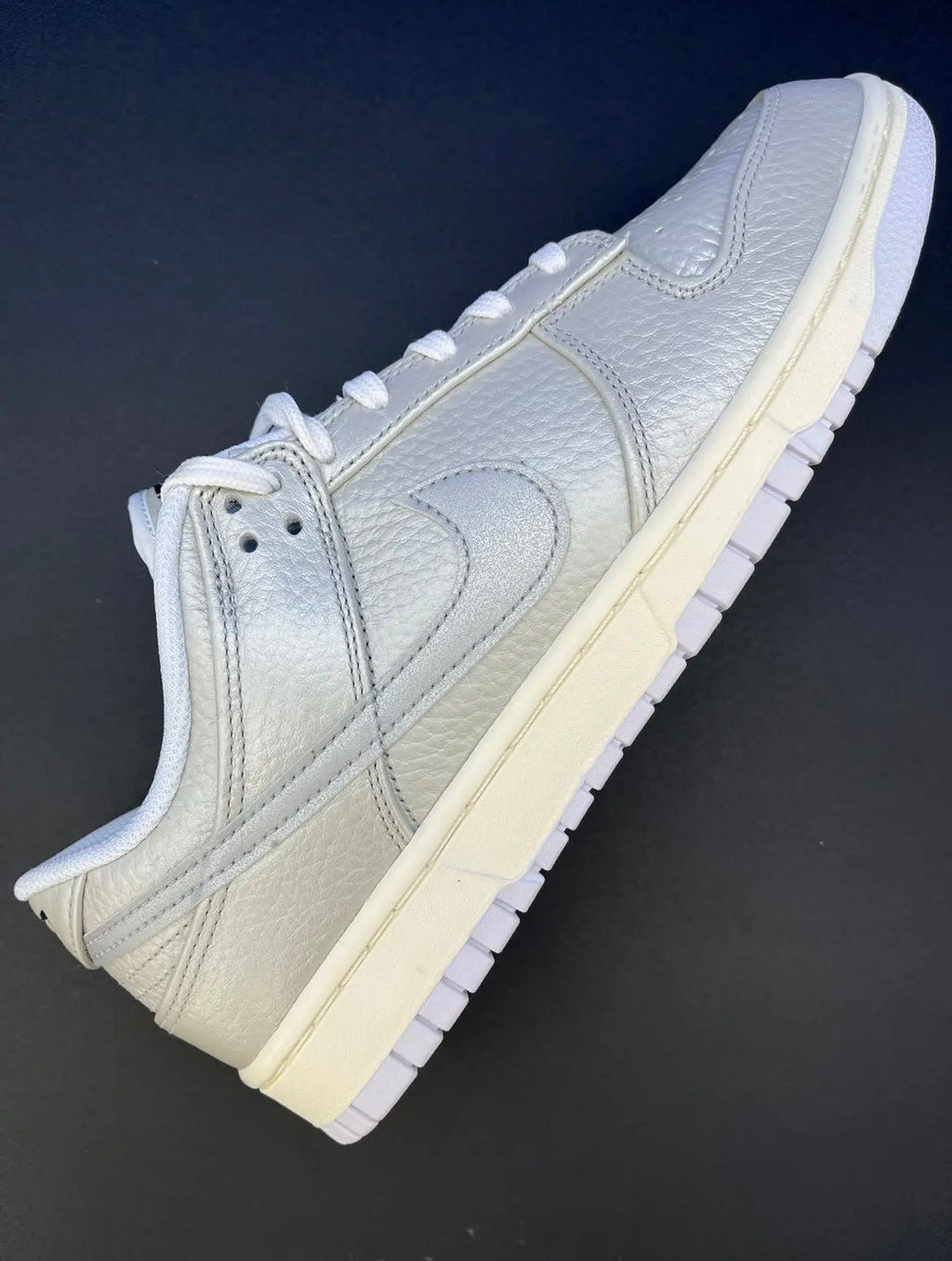 Nike Dunk Low Sneakers in Metallic Silver DX3197-095 - product image from the listing.