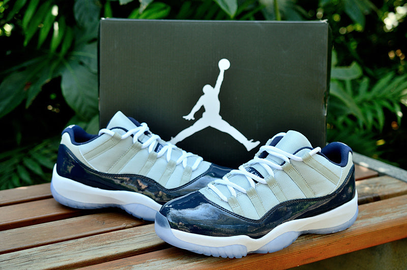 Air Jordan 11 Retro Low Sneakers, White and Navy - product image from the listing.