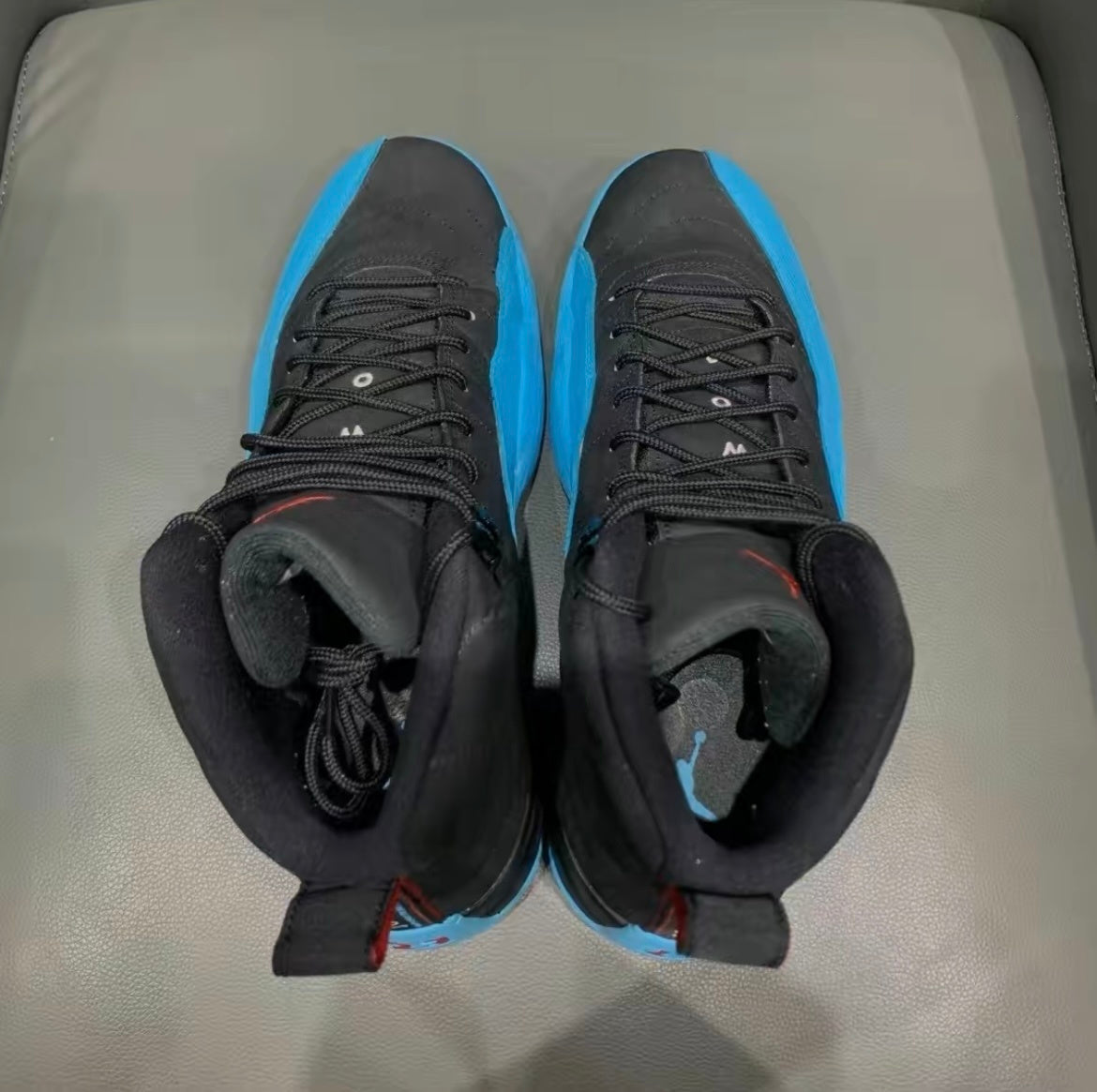 Air Jordan 12 Retro Gamma High-Top Sneakers in Blue 130690-027 - product image from the listing.