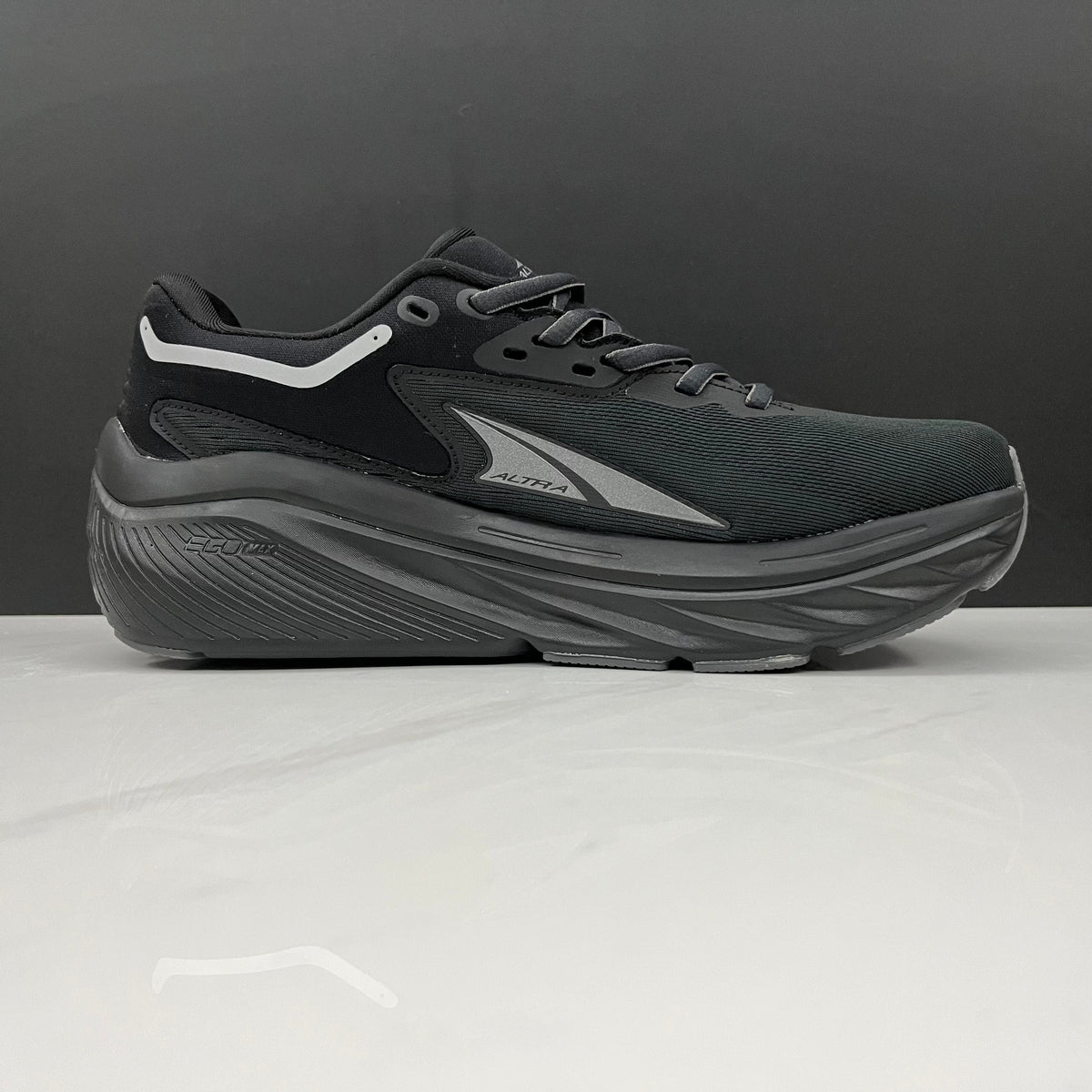 Altra Via Olympus Running Sneakers in Black - product image from the listing.