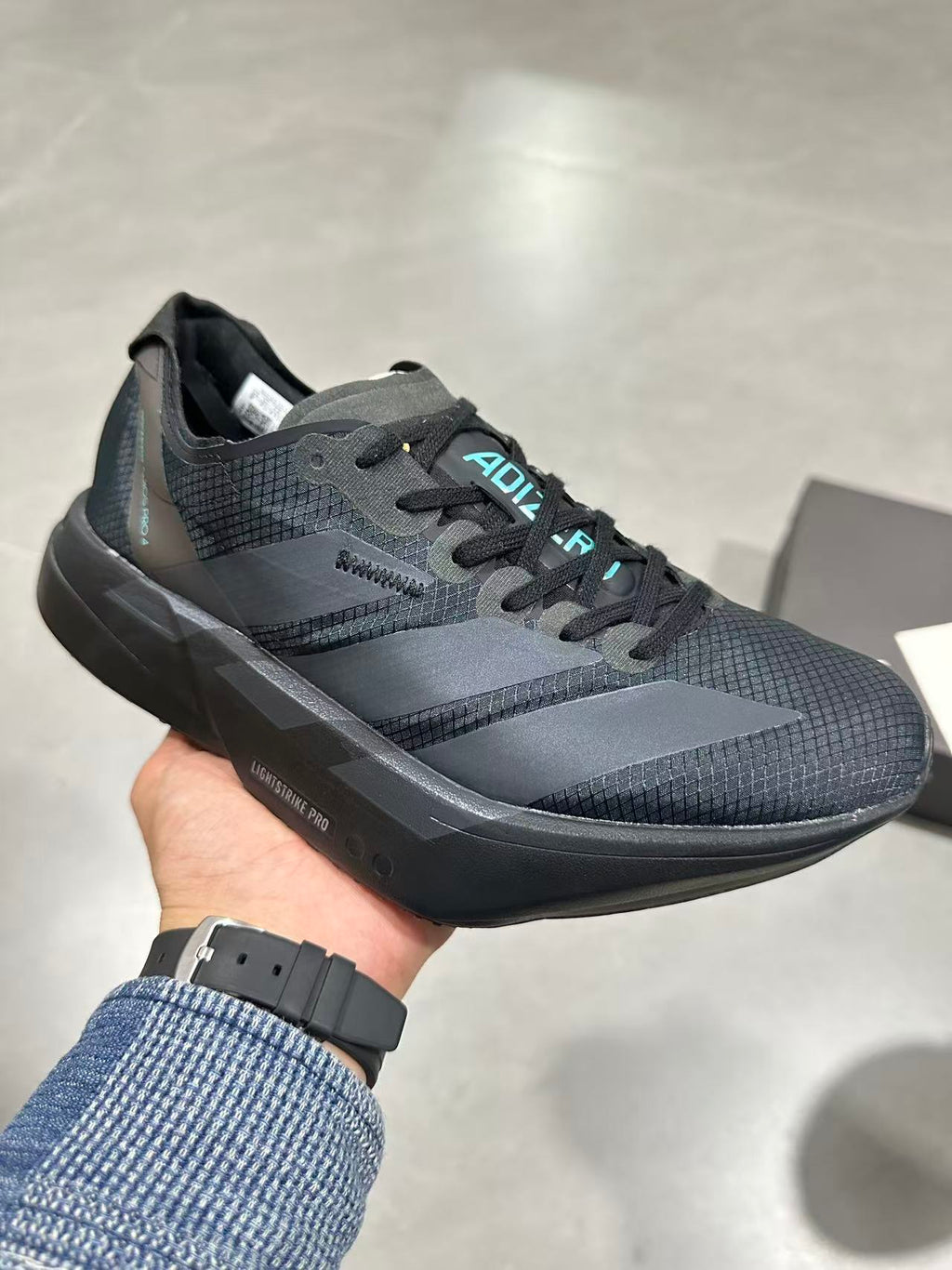 Nike Lightstrike Pro Running Shoes in Black Gray HQ7411 - product image from the listing.