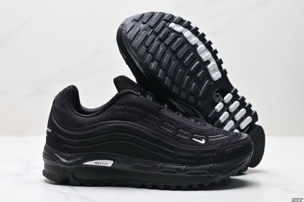 Nike Air Max Plus x Comme des Garçons Sneakers in Black - product image from the listing.