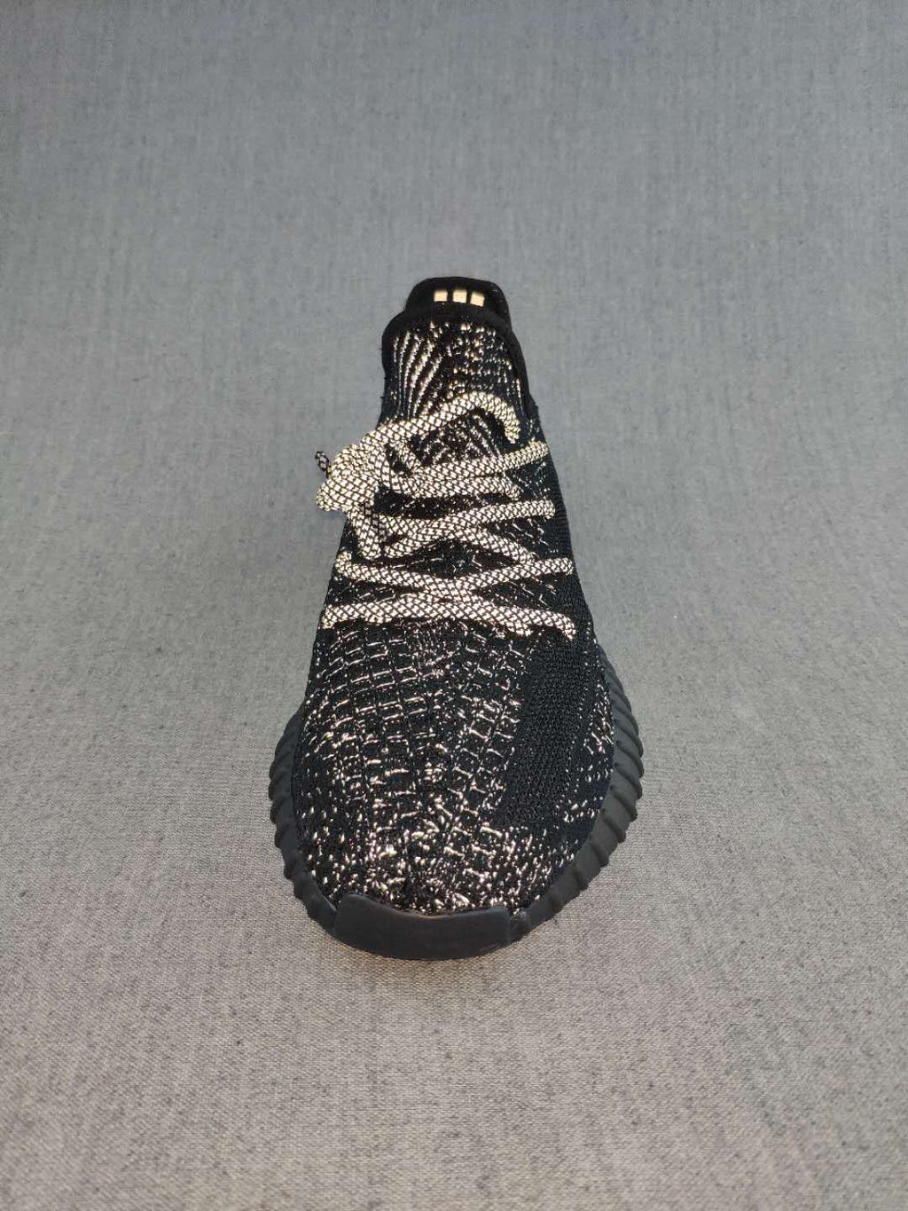 Black and Cream Yeezy 350 V2 Knit Sneakers - product image from the listing.