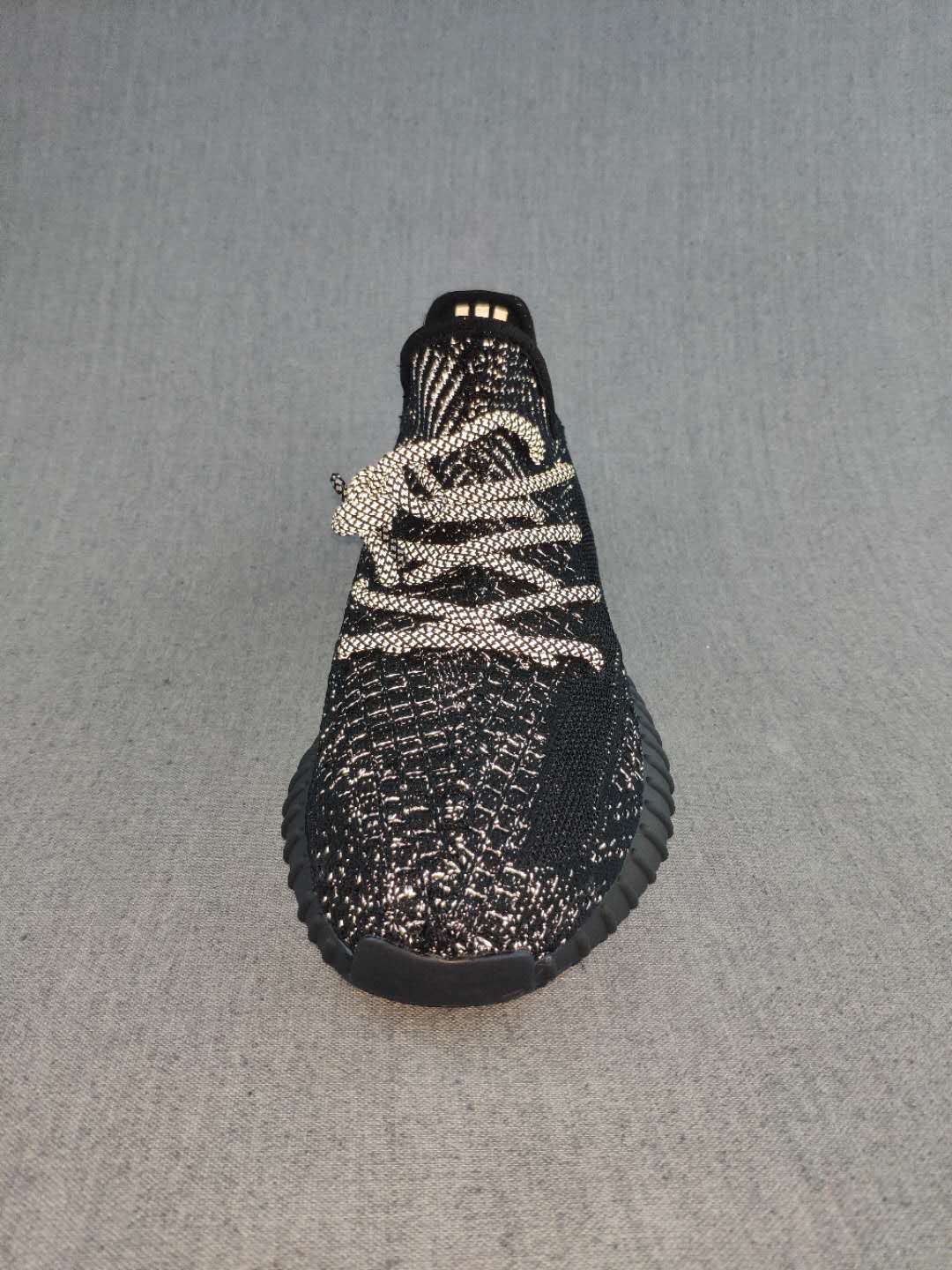 Black and Cream Yeezy 350 V2 Knit Sneakers - product image from the listing.