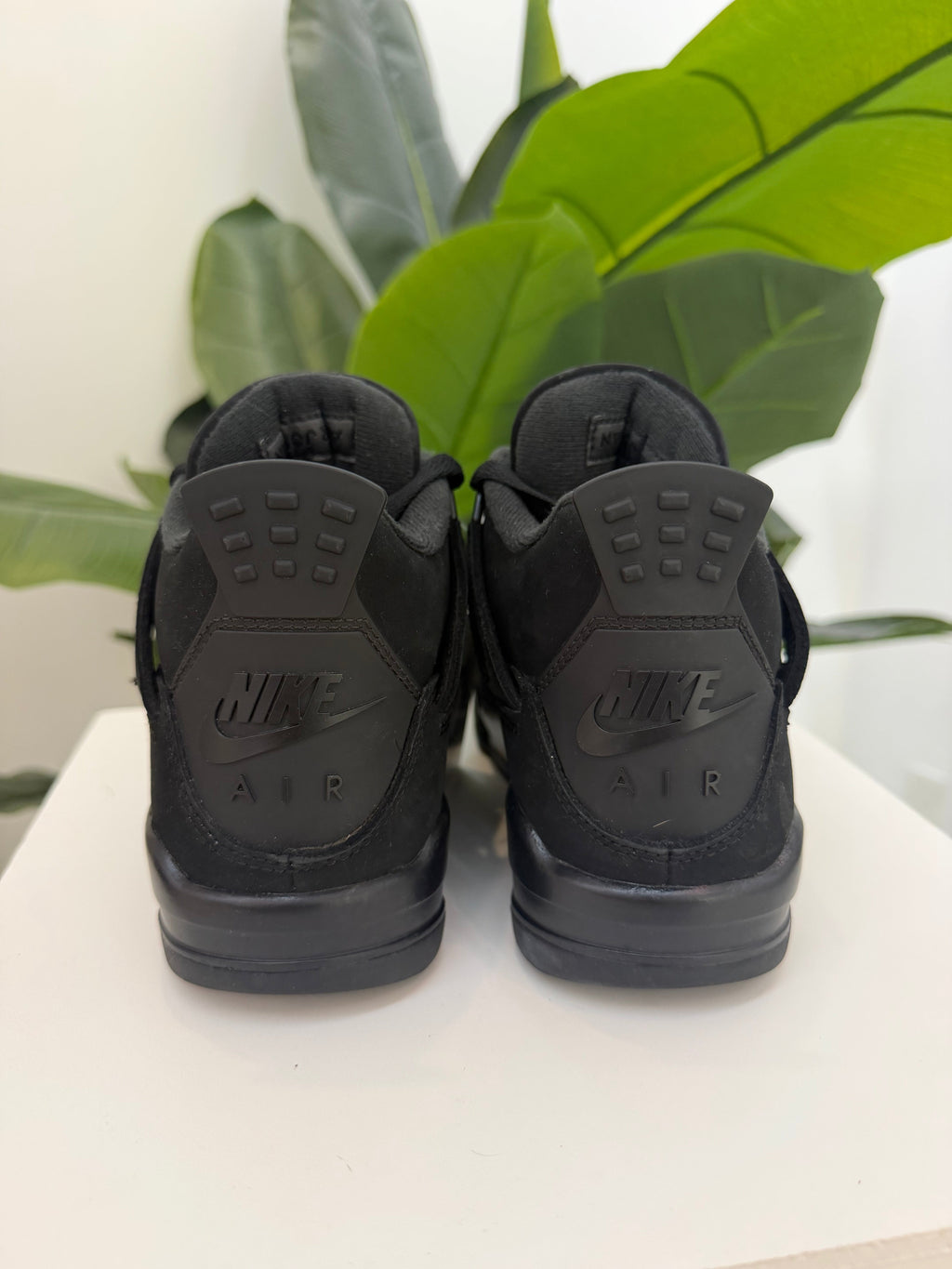 Black Cat Jordan 4 (2025) - product photo shown in the listing for this item.