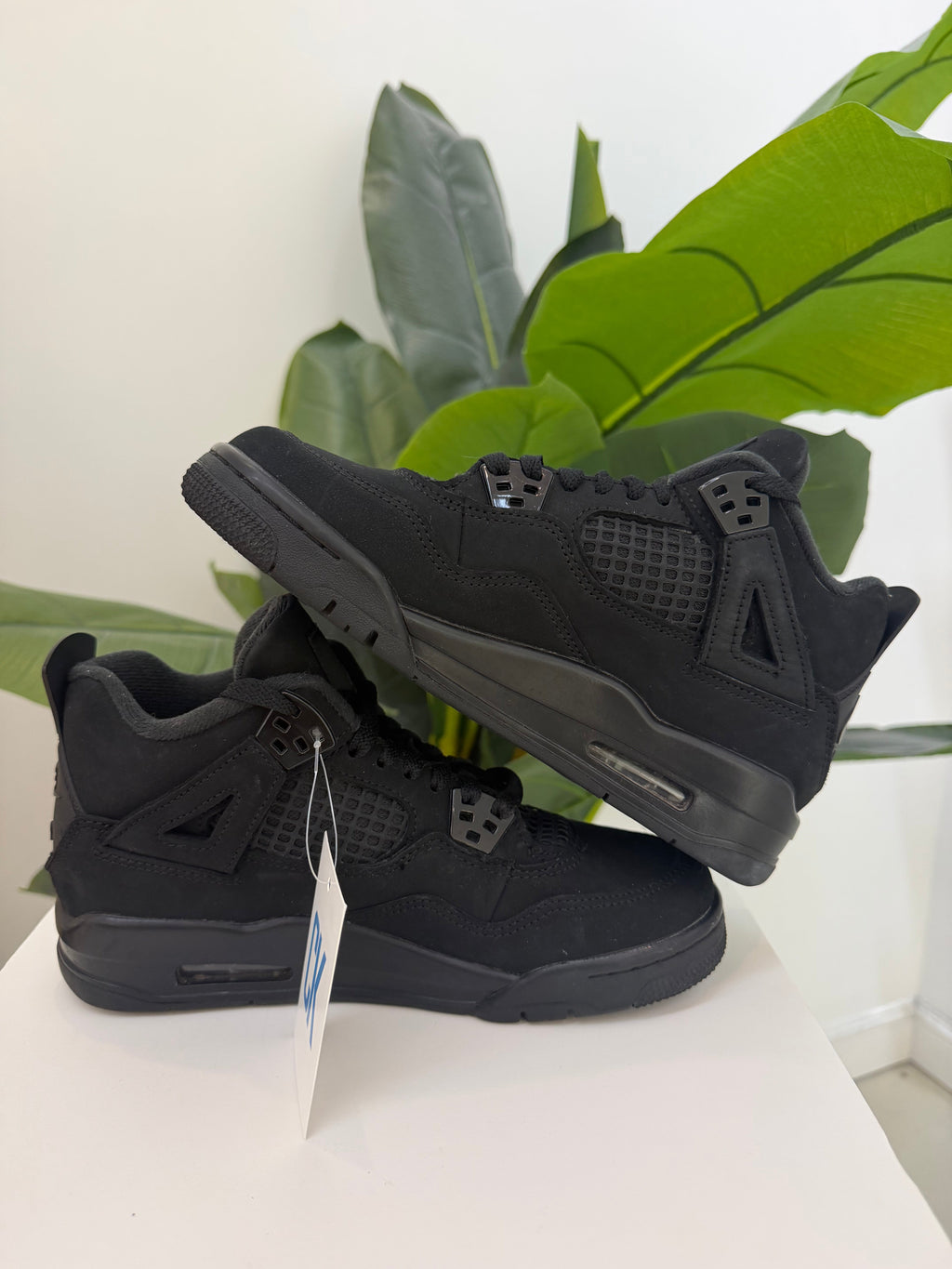Black Cat Jordan 4 (2025) - product photo shown in the listing for this item.
