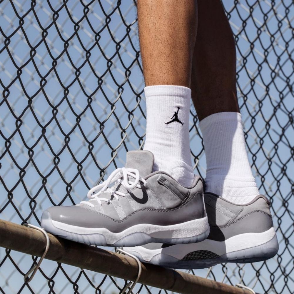Air Jordan 11 Retro Low Cement in Grey - product image from the listing.