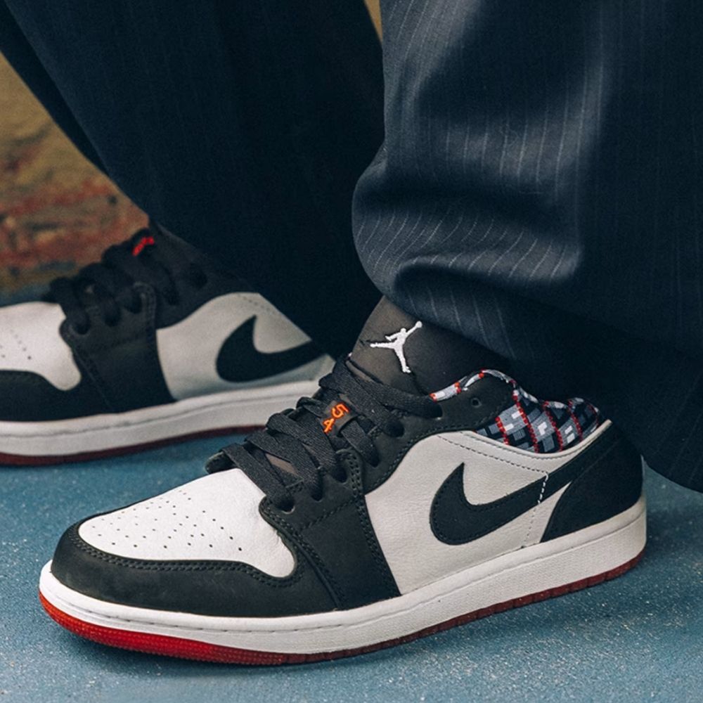 Air Jordan 1 Low Quai 54 in Black White - product image from the listing.