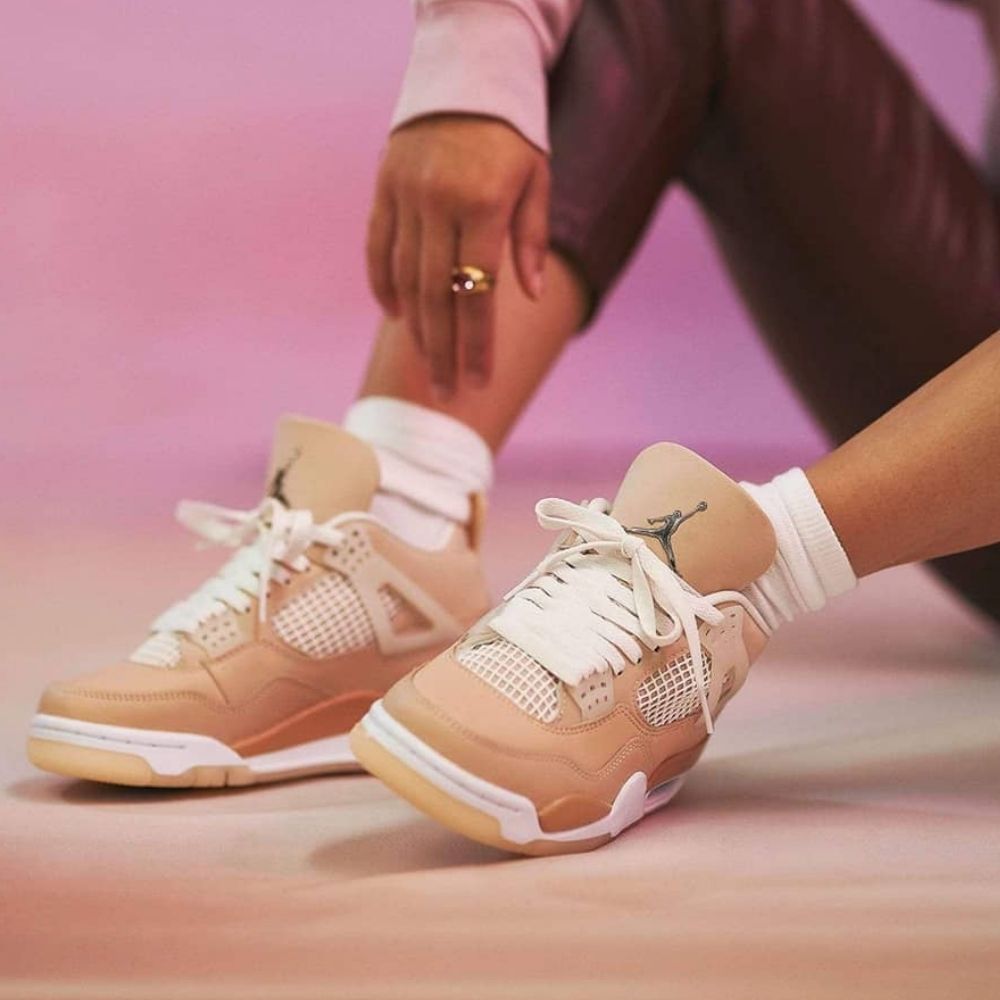 Air Jordan 4 Retro Shimmer in Metallic Silver Orange - product image from the listing.