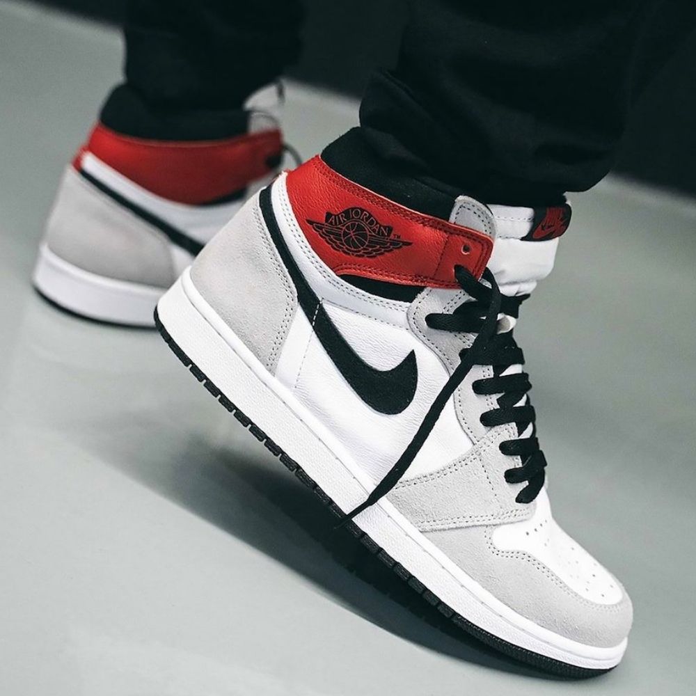 Air Jordan 1 Retro High in Light Smoke Grey - product image from the listing.