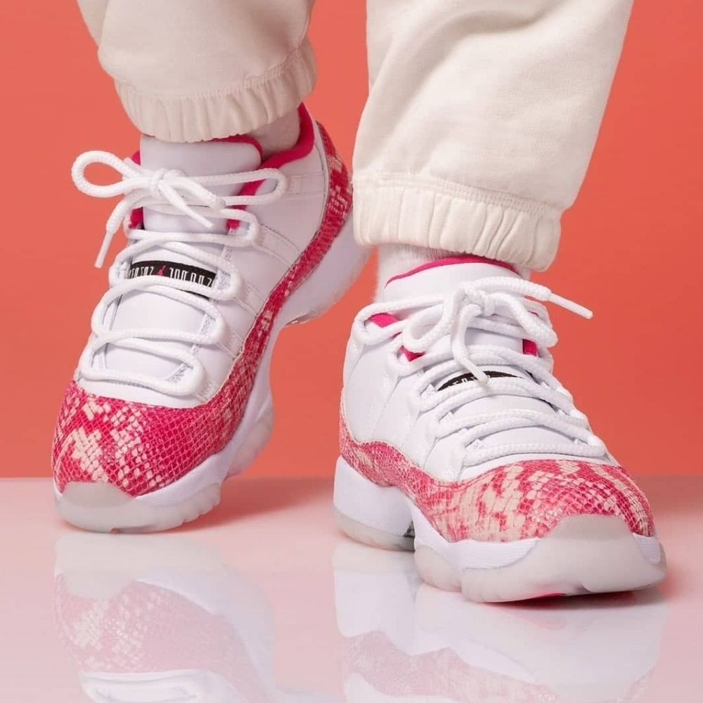 Air Jordan 11 Low Pink Snakeskin in White - product image from the listing.