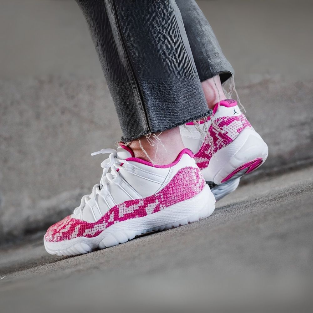 Air Jordan 11 Low Pink Snakeskin in White - product image from the listing.