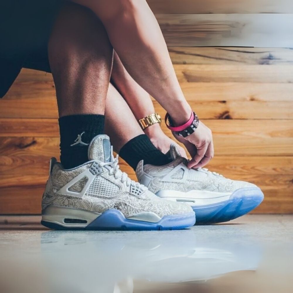 Air Jordan 4 Retro 30th Anniversary Laser in White Metallic Silver - product image from the listing.