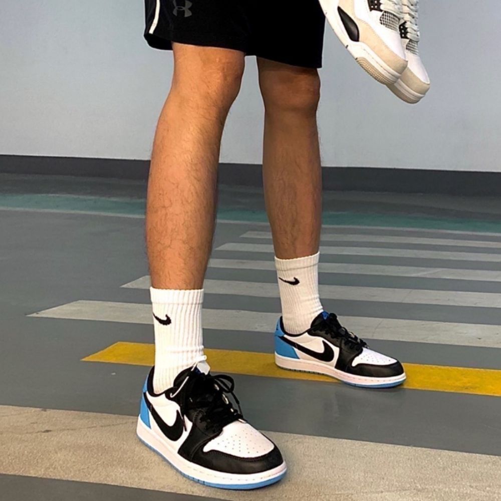 Air Jordan 1 Retro Low OG UNC Black Power in Blue - product image from the listing.