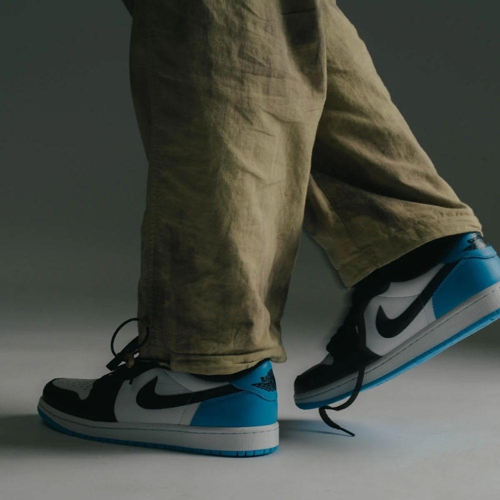Air Jordan 1 Retro Low OG UNC Black Power in Blue - product image from the listing.