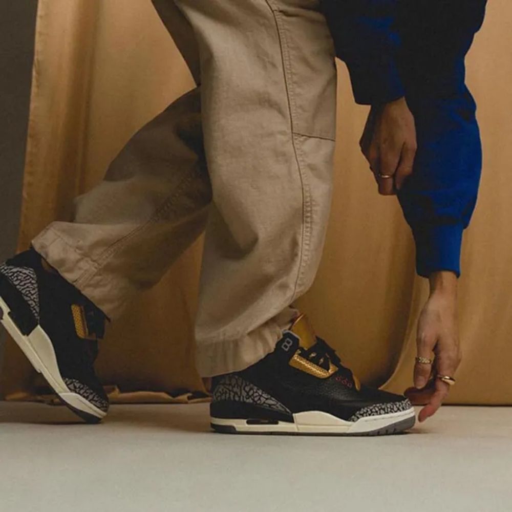Air Jordan 3 Retro Black Cement in Gold - product image from the listing.