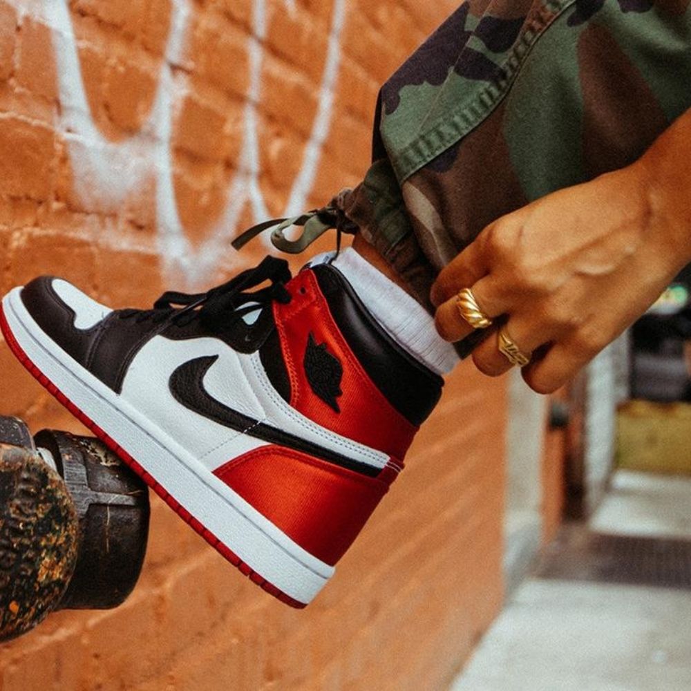 Air Jordan 1 Retro High Satin Black Toe in Red - product image from the listing.