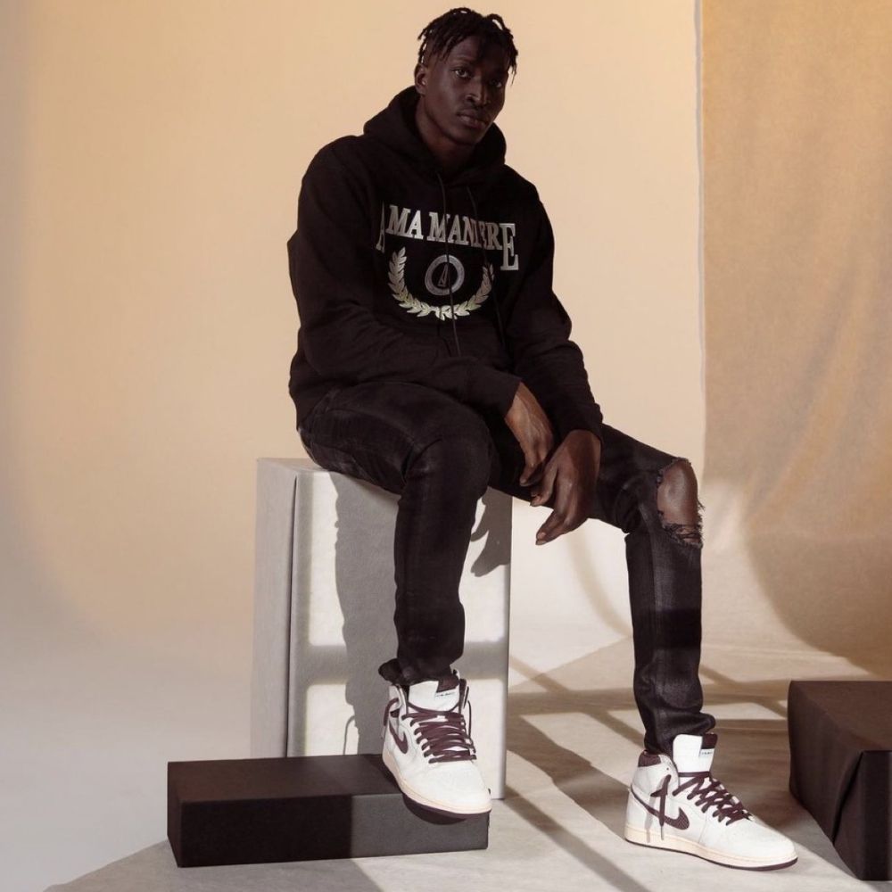 Air Jordan 1 High OG X A Ma Maniére Airness in Sail Burgundy Red - product image from the listing.