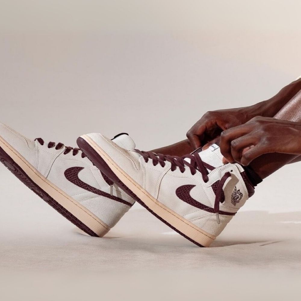 Air Jordan 1 High OG X A Ma Maniére Airness in Sail Burgundy Red - product image from the listing.