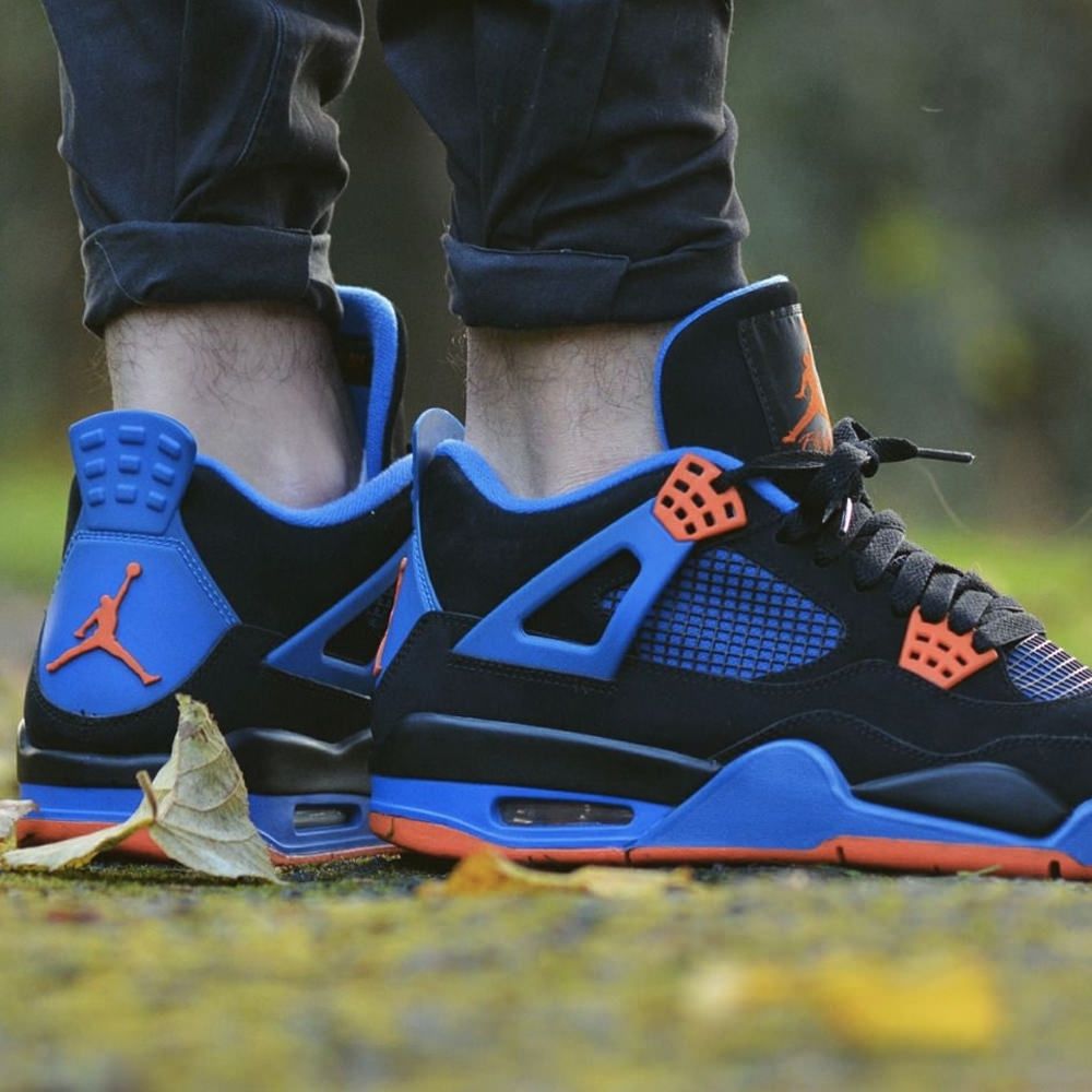 Air Jordan 4 Retro Cavs in Black Blue - product image from the listing.