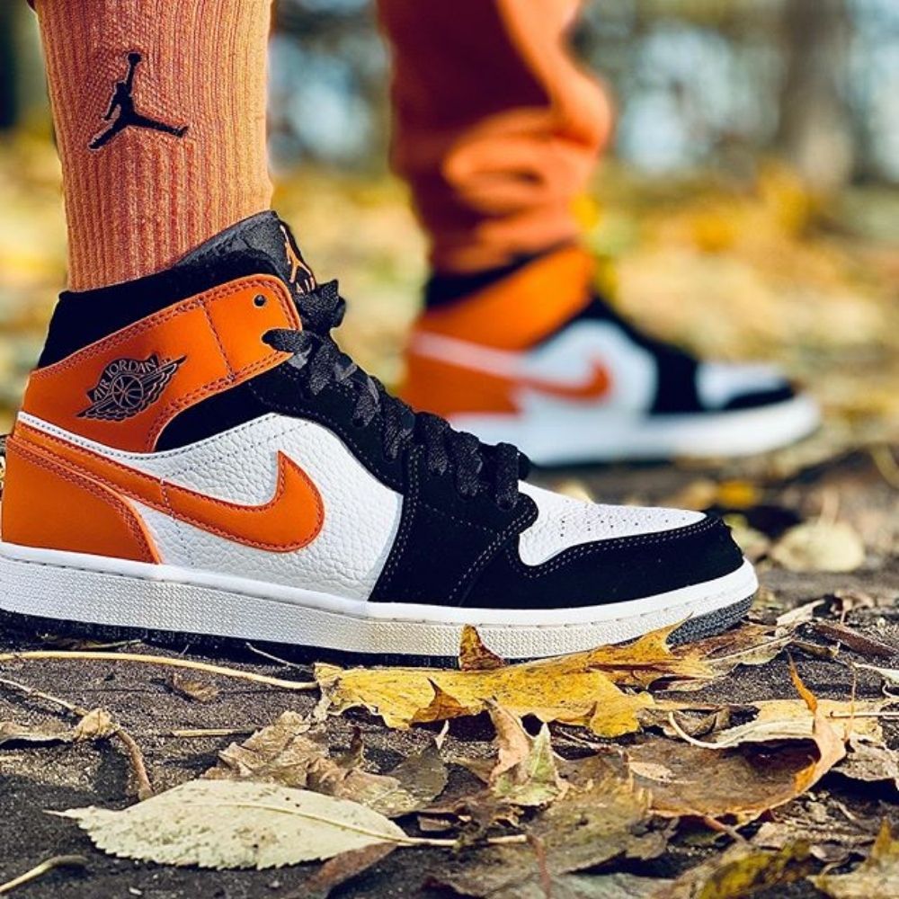 Air Jordan 1 Mid Shattered Backboard in Orange Black - product image from the listing.