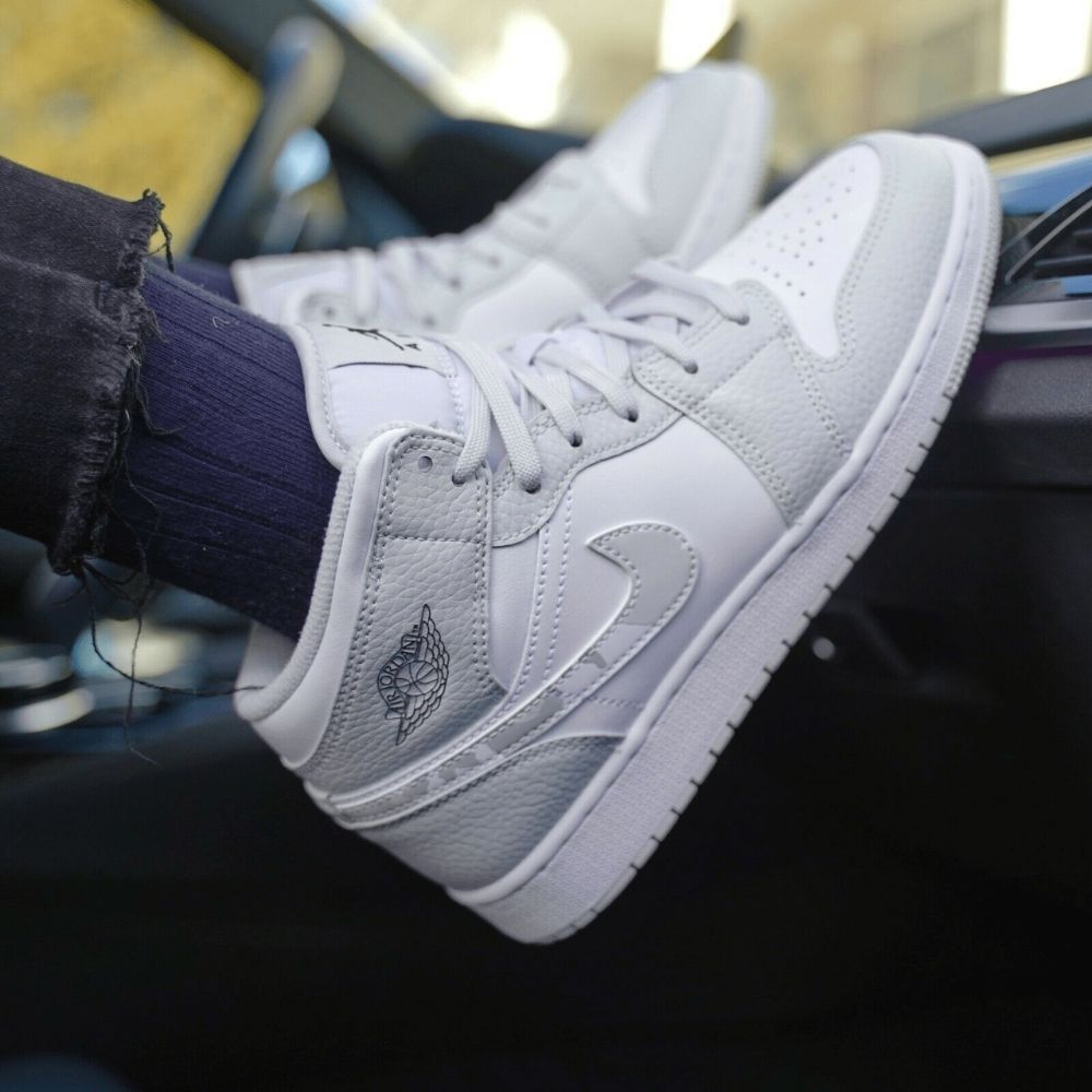 Air Jordan 1 Mid Swoosh Logo Grey Camo in White - product image from the listing.