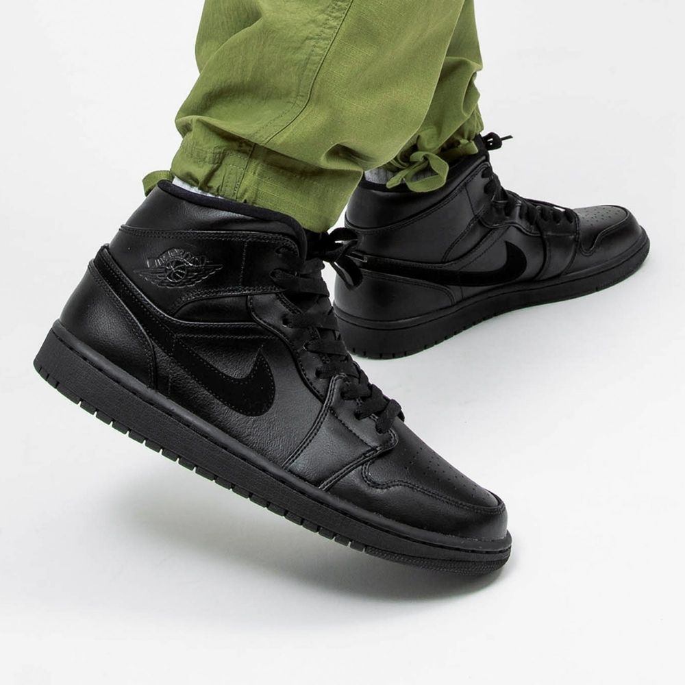 Air Jordan 1 Mid Triple in Black - product image from the listing.