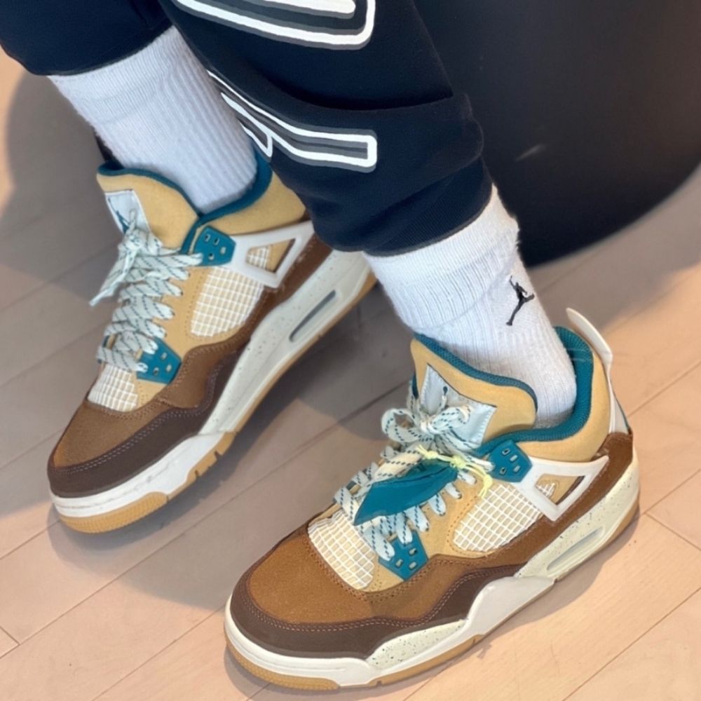 Air Jordan 4 Retro Cacao Wow in Brown Sail - product image from the listing.