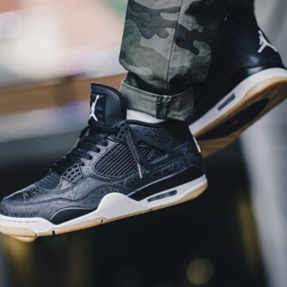 Air Jordan 4 Retro Laser in Black - product image from the listing.