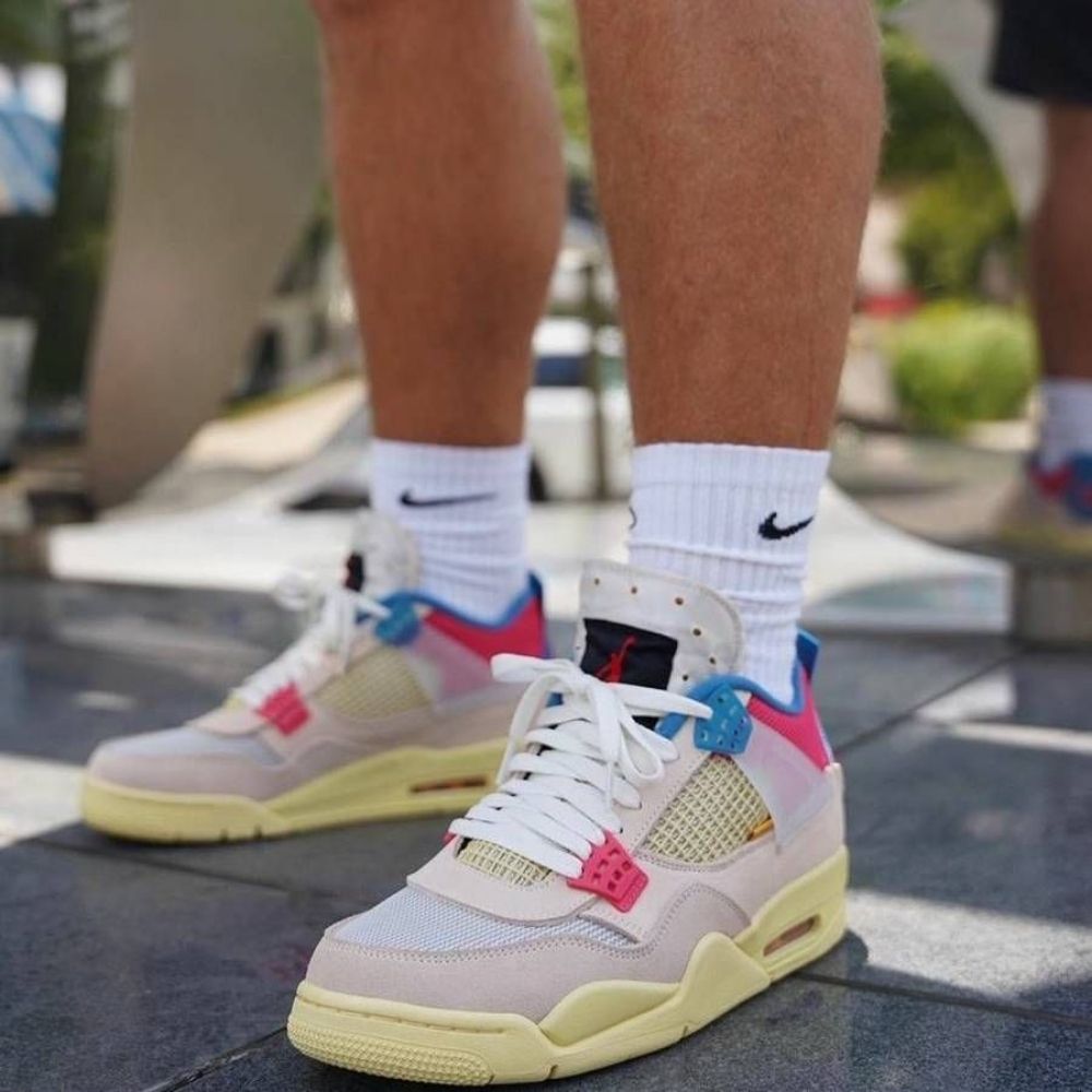 Air Jordan 4 Retro x Nike Air Union LA Guava in Ice Pink - product image from the listing.