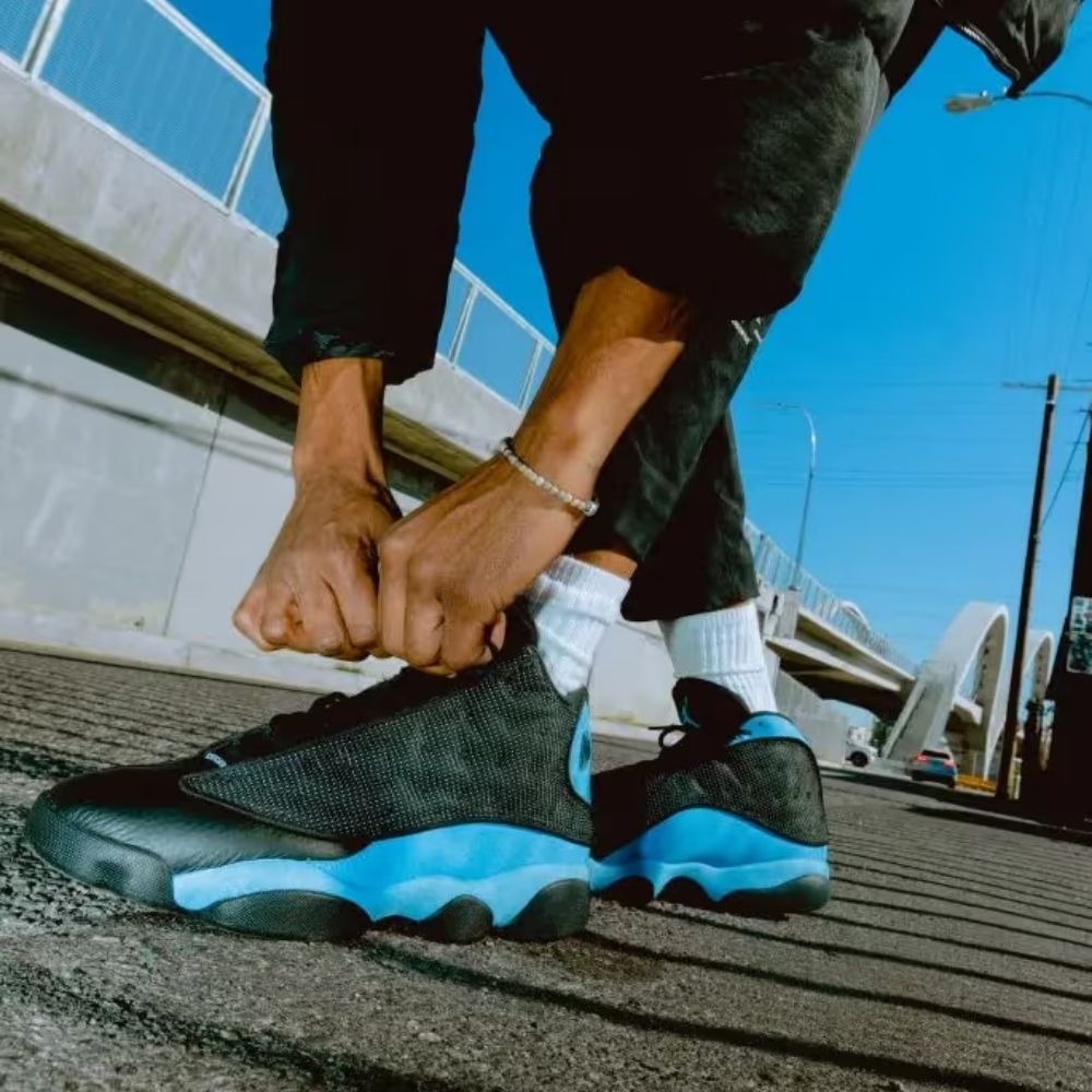 Air Jordan 13 Retro in Black University Blue - product image from the listing.