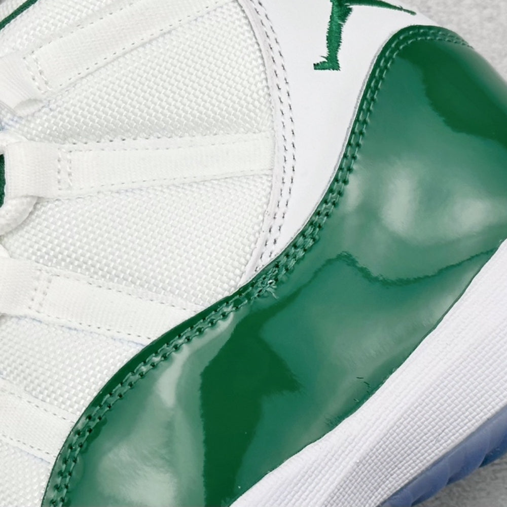 Air Jordan 11 Retro High in White And Green - product image from the listing.