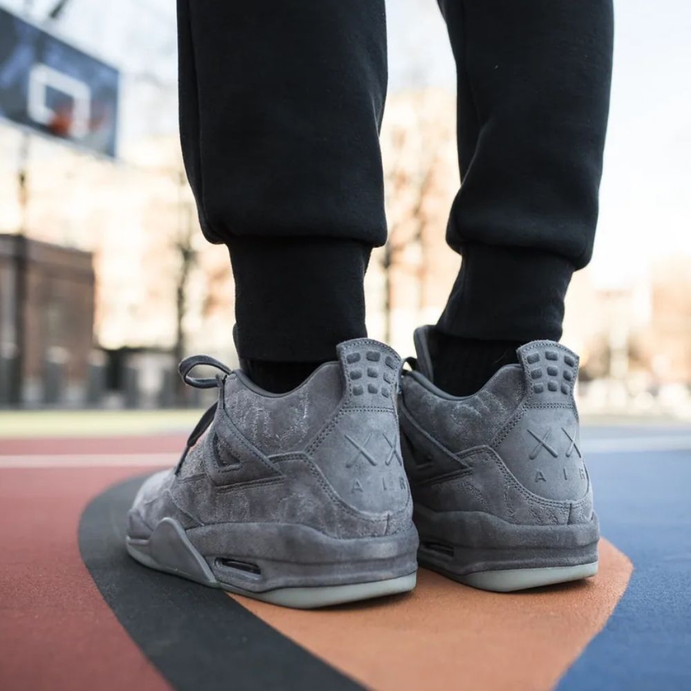 Air Jordan 4 Retro x KAWS in Cool Grey - product image from the listing.