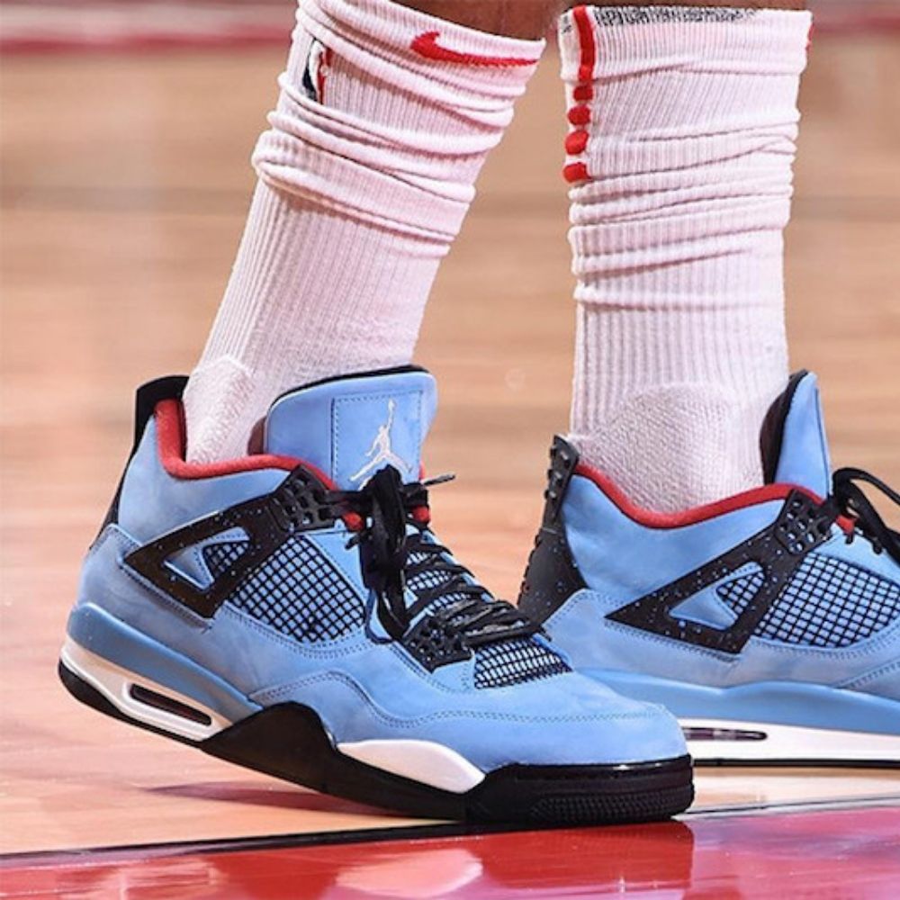 Air Jordan 4 Retro x Travis Scott Cactus Jack in University Blue - product image from the listing.