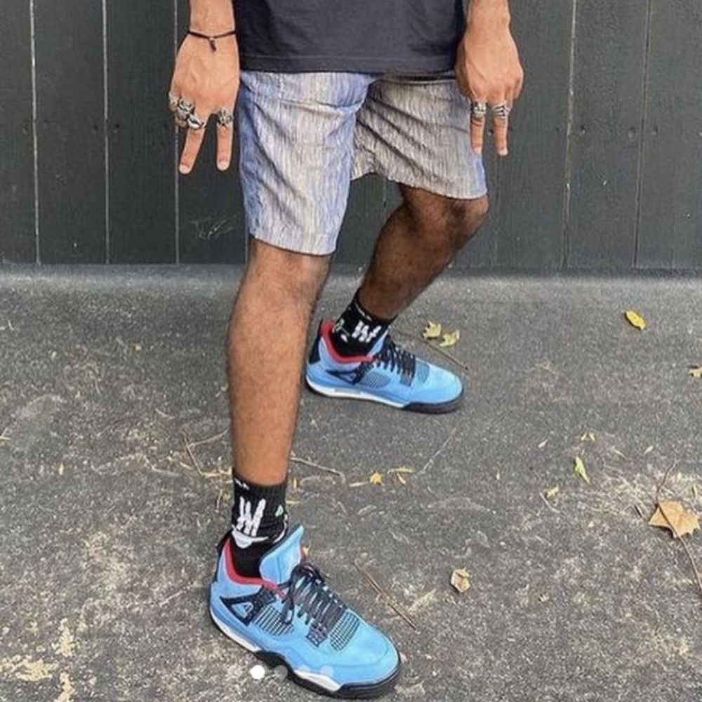 Air Jordan 4 Retro x Travis Scott Cactus Jack in University Blue - product image from the listing.