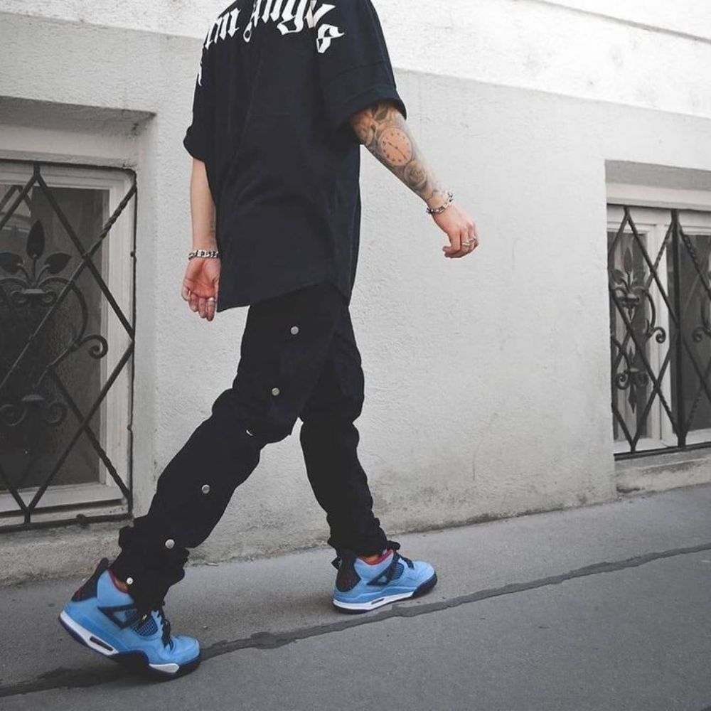Air Jordan 4 Retro x Travis Scott Cactus Jack in University Blue - product image from the listing.