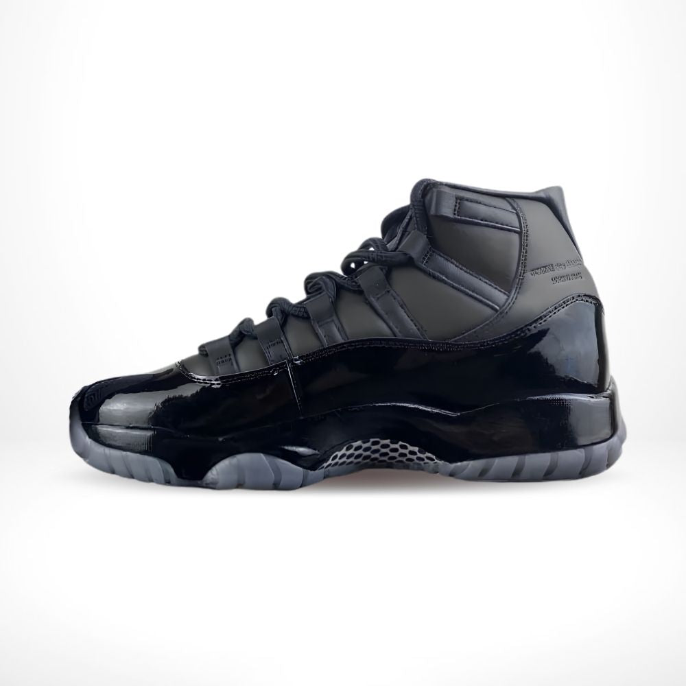 Air Jordan 11 Comme des Garçons Homme Plus in Black - product image from the listing.
