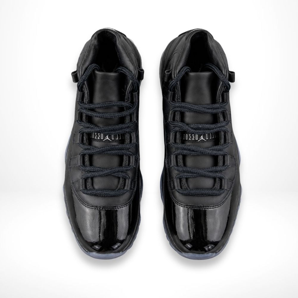 Air Jordan 11 Comme des Garçons Homme Plus in Black - product image from the listing.