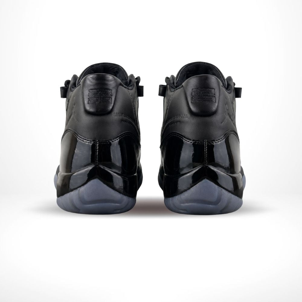 Air Jordan 11 Comme des Garçons Homme Plus in Black - product image from the listing.