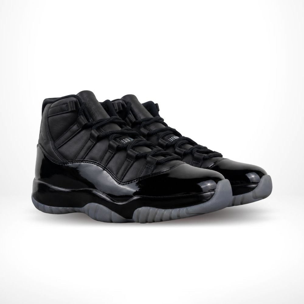 Air Jordan 11 Comme des Garçons Homme Plus in Black - product image from the listing.
