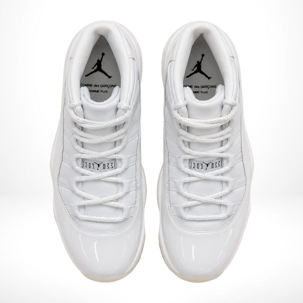 Air Jordan 11 Comme des Garçons Homme Plus in White - product image from the listing.