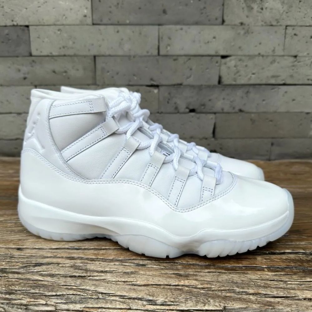 Air Jordan 11 Comme des Garçons Homme Plus in White - product image from the listing.