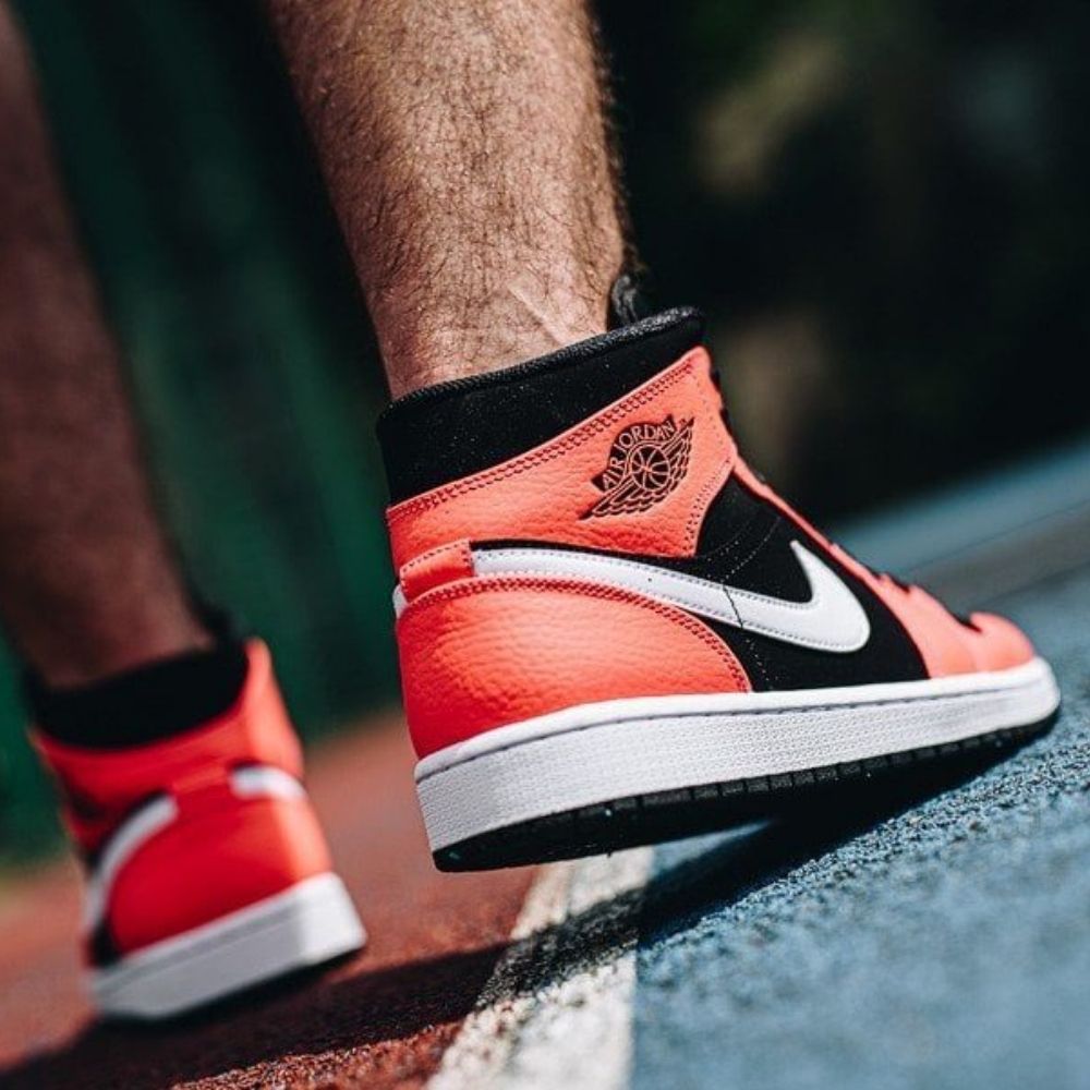 Air Jordan 1 Mid Infrared 23 in Black Red - product image from the listing.